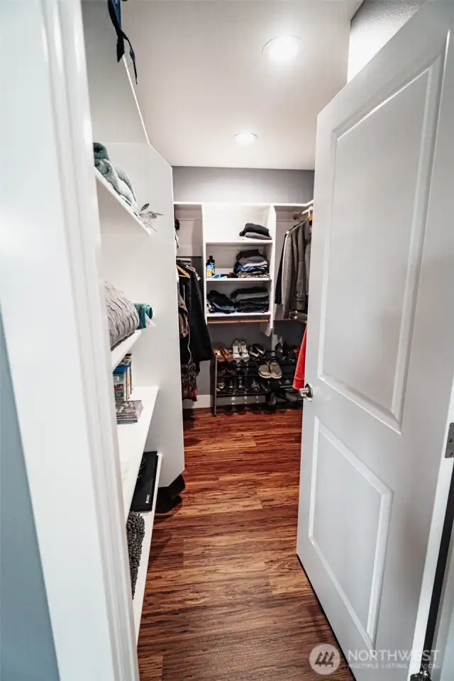 Walk in closet in primary bedroom.