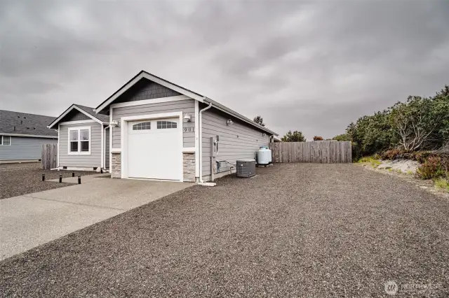 Huge space to park an RV, plus a 14 foot fence that opens. Notice the two propane tanks. One is for the generator that automatically kicks in when the power goes out.