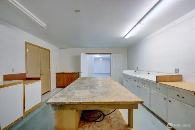 Large workshop space has 220 wiring and the huge worktable stays