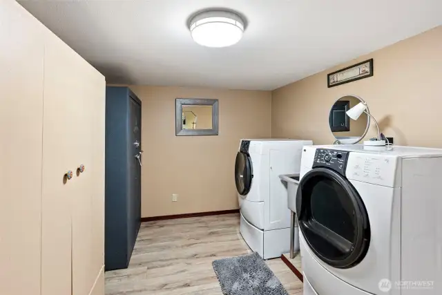 Downstairs large laundry room with ample storage.