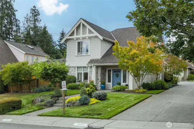Front view with drive to garage in rear of home