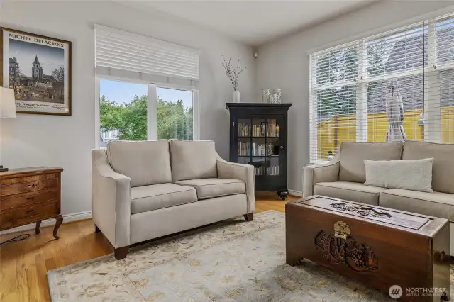 Living room with view to street, front yard and patio area