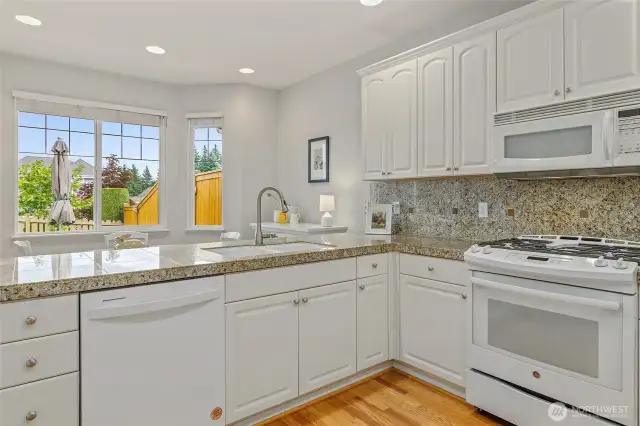 Kitchen with informal dining space, view to patio