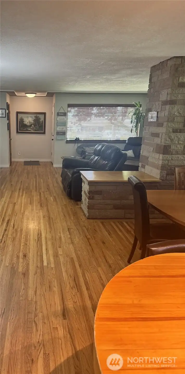 View from kitchen displaying the original hardwood flooring!