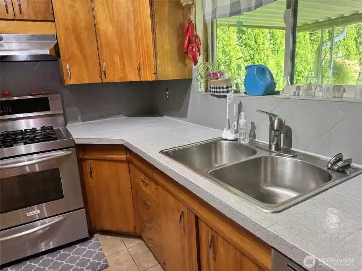 Lovely kitchen with plenty of room on counters for preparing the meals!