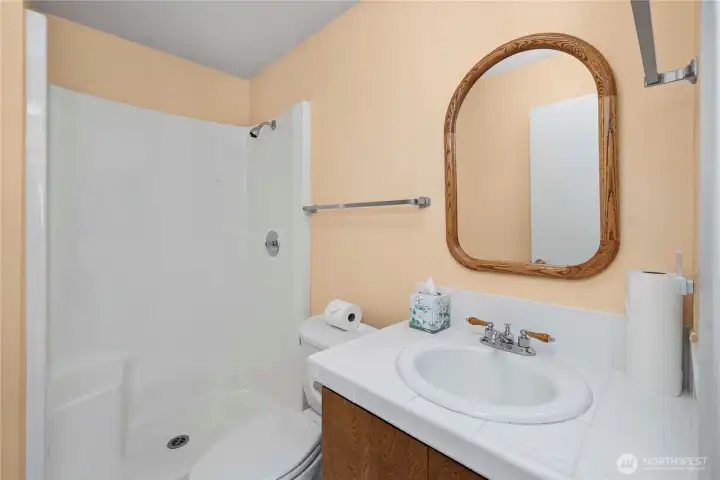 3/4 bathroom downstairs servicing the basement.