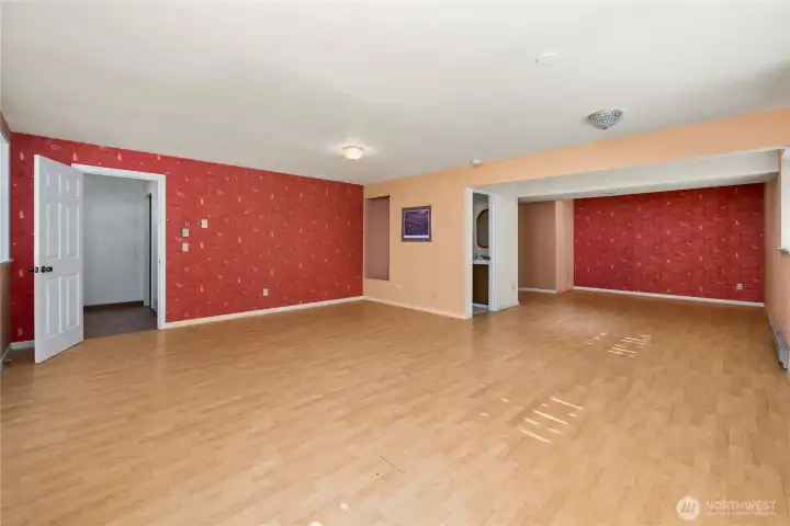 Huge basement, was being used as a dance floor with mirrors.