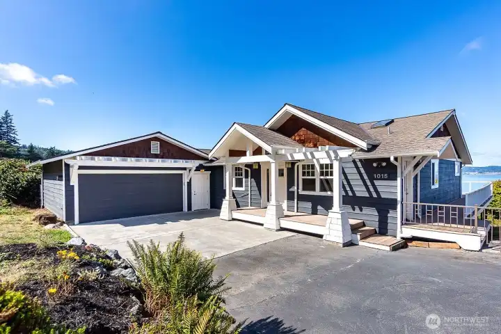 Home garage and driveway and showcasing amazing views