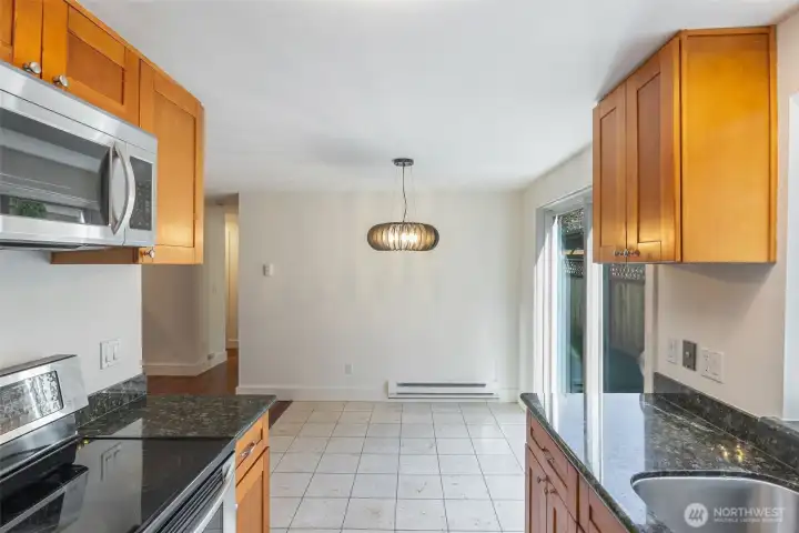 View towards eating area, living room and hallway to sleeping quarters