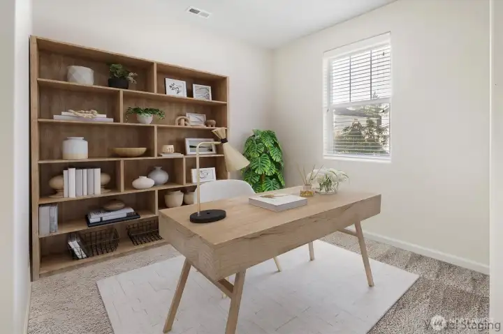 A quiet, sunlit office by the entry — perfect for focused work, homework sessions (Virtually Staged)