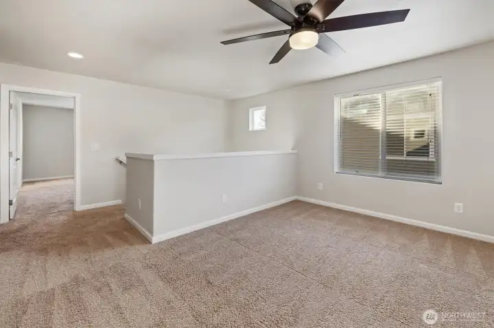 Upper level features a versatile flex room and bedrooms