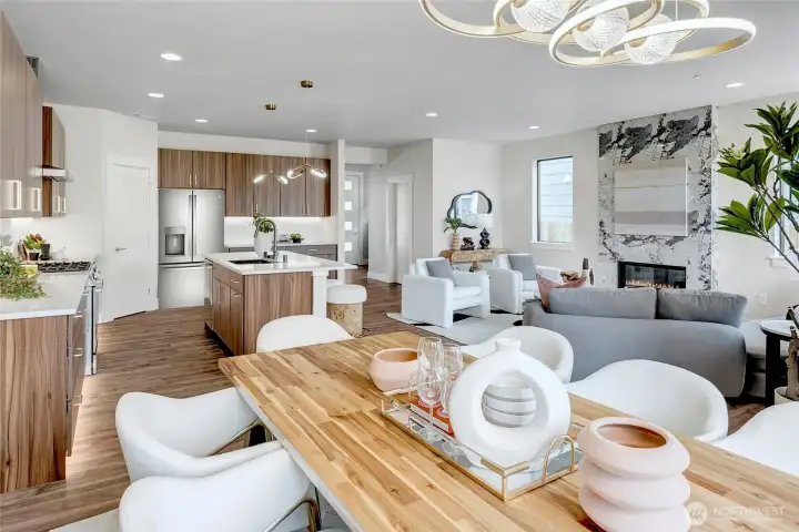 Separated dining room featuring unique lighting fixtures (model home lot 1A, colors may vary)