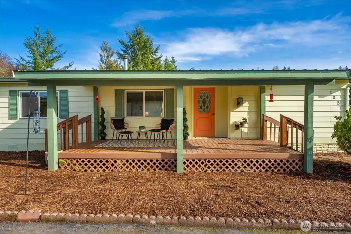 Expansive covered TREX DECK creates the perfect setting for year-round entertaining or relaxing in privacy.