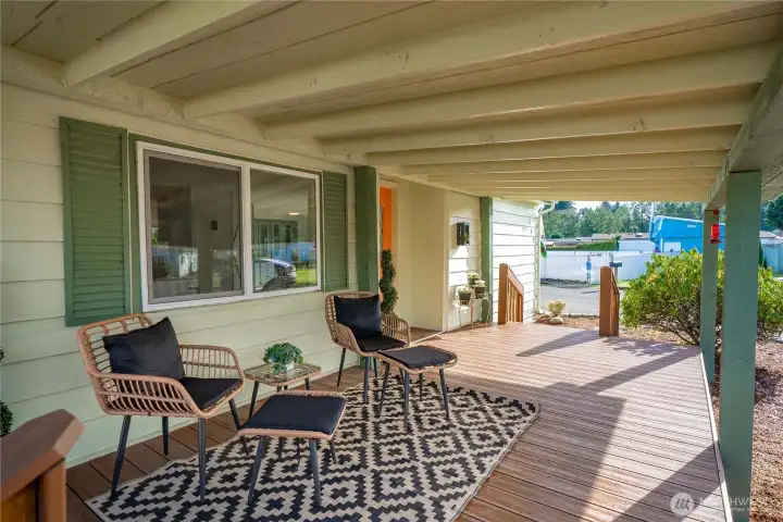 Unwind on the covered TREX DECK with peaceful views and comfortable seating—ideal for morning coffee or evening sunsets.