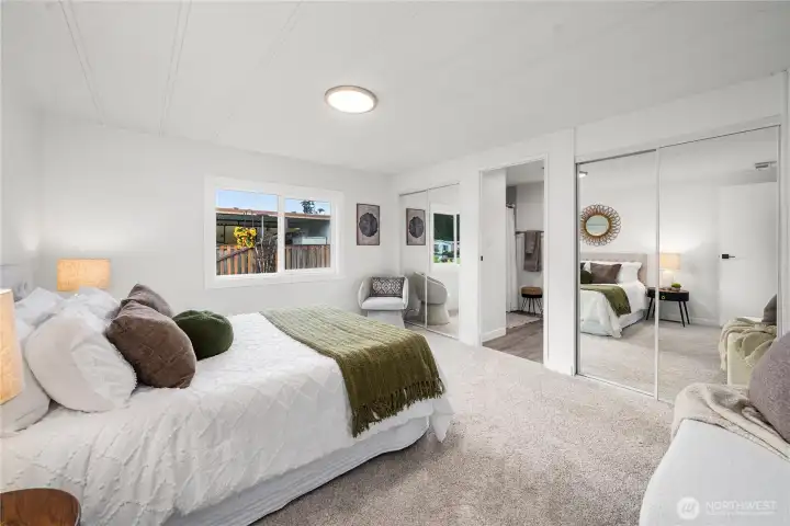 Generous primary suite offers comfort and privacy, complete with a double closet featuring NEW mirrored doors for added light and functionality.