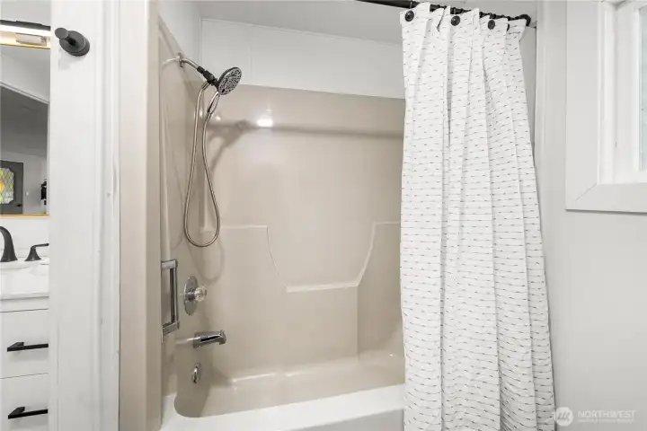Guest bath includes a convenient shower/tub combo for comfort and practicality.
