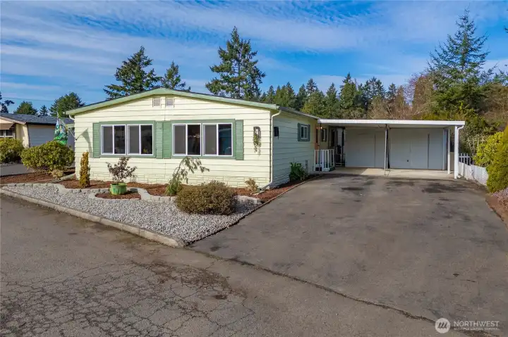 Attractive front elevation with freshly painted exterior, solar lights & ample driveway parking enhances curb appeal.