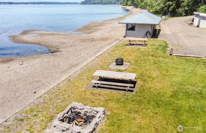 Private beach access with picnic area, fire pit & cabana creates the ultimate waterfront retreat just steps from home.
