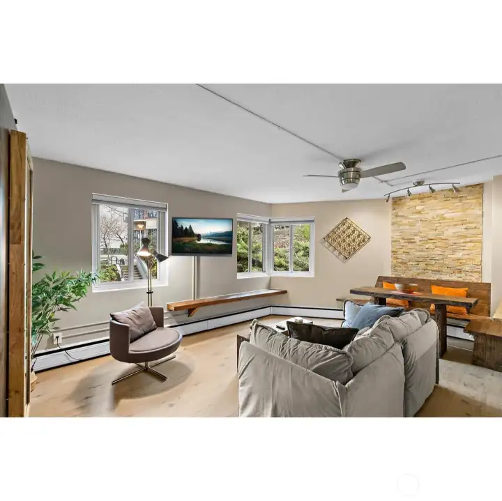 Living room from Hallway.  Digital TV covers wall mount and plug in - needs repair behind TV