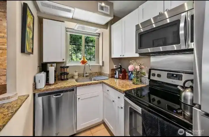 Kitchen with window view of trees