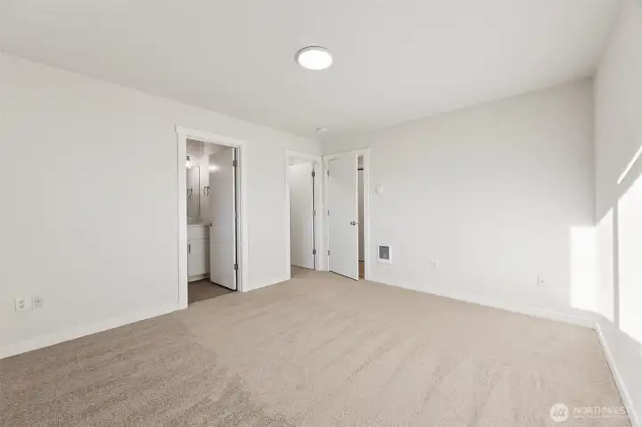 Primary bedroom with separate bath and walk in closet