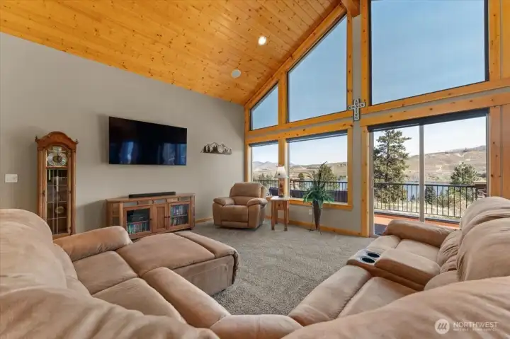 Living room with sliding glass doors onto deck.