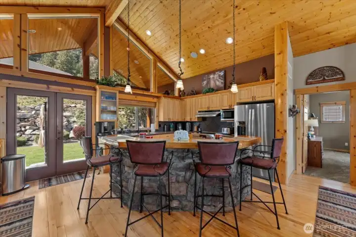 Kitchen with high quality stone eating bar.