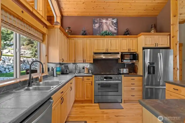 Ample space and plenty of cabinets.  Oven is conventional/convection with induction stovetop.