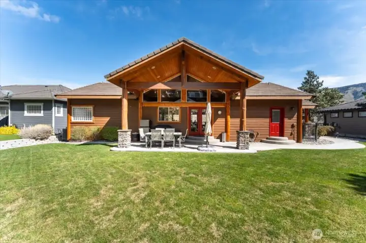 Covered back patio with low-maintenance landscaping.