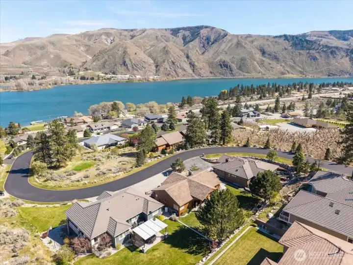 Aerial of home in Shadow Ridge Subdivision with community waterfront & dock below.