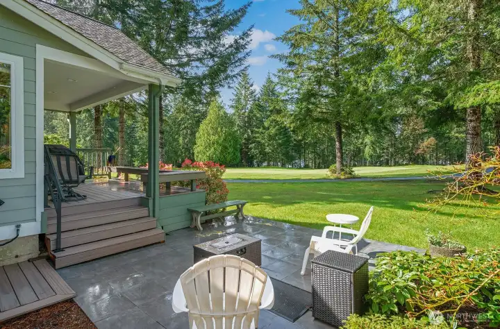 Front-row seat to the beauty of Lakeland Village Golf Course from lovely slate patio--perfect for a glass of wine with friends after playing 9!