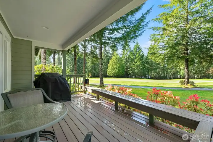 Expansive greenbelt and fairway views create a tranquil setting