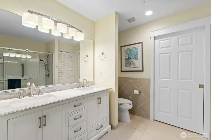 Bright bathroom with ample storage, walk in closet and recently installed walk in shower