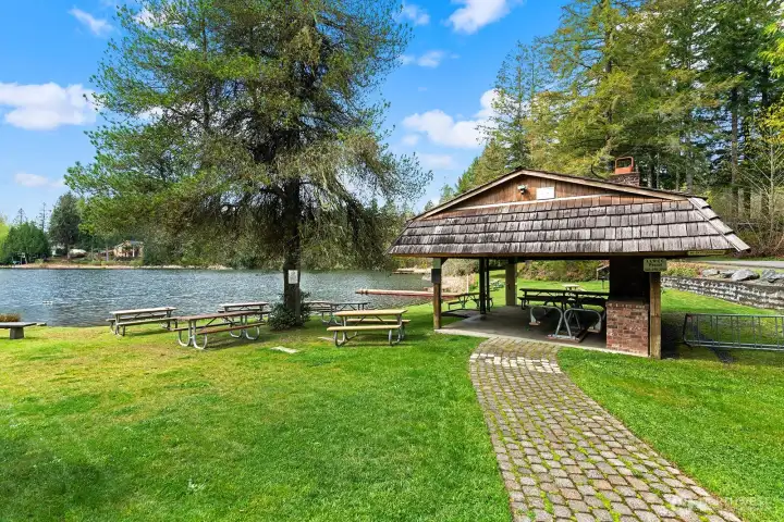 Lakeland Village community beach featuring swimming area and covered picnic/entertaining space