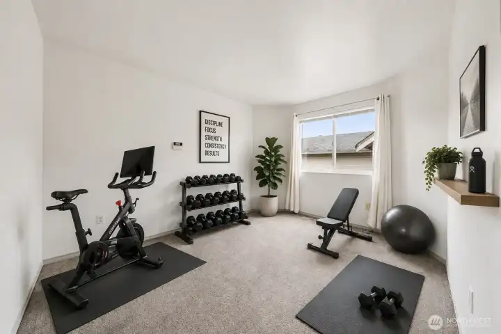 Loft as an exercise area or an office. Virtually staged.