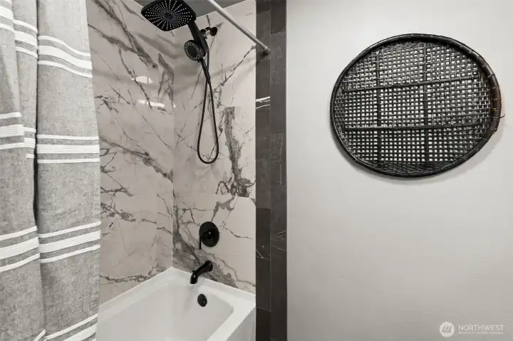 Second bathroom newly retiled bath