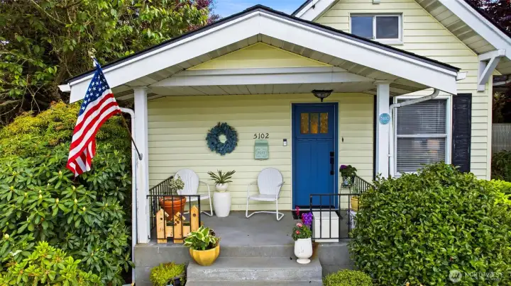 Covered front porch and new front door.  The perfect place to sit and drink your morning coffee.