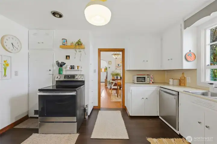 Light and bright kitchen with newer painted cabinets.