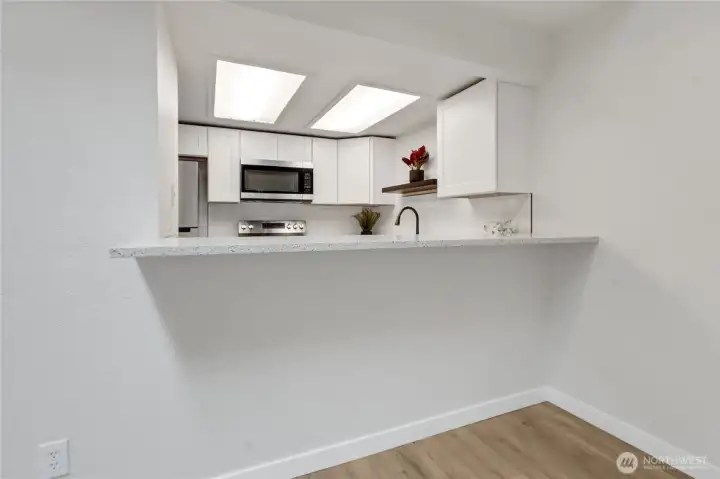 Opening to kitchen from living area. Opening to kitchen from living area.
