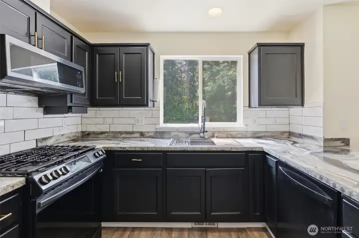 New appliances that stay with home. Enjoy view of backyard as you wash the dishes