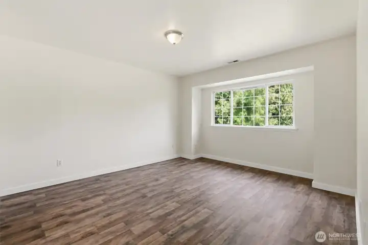 Primary suite with natural light, private bathroom and close