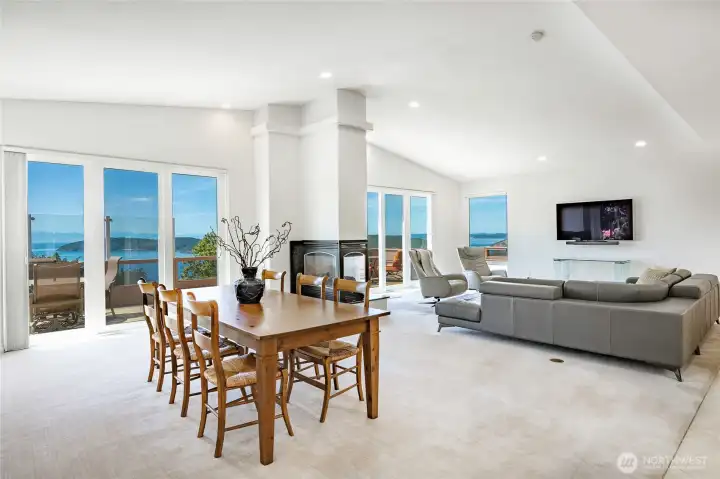 Open and bright with vaulted ceilinga and walls of windows, sliders that open onto the entertainment deck with that mesmerizing view Open and bright with vaulted ceilinga and walls of windows, sliders that open onto the entertainment deck with that mesmerizing view