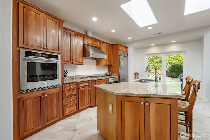 Bright, happy kitchen, LOTS of custom cabinets and premium appliances, subzero fridge, granite counters and large center island Bright, happy kitchen, LOTS of custom cabinets and premium appliances, subzero fridge, granite counters and large center island
