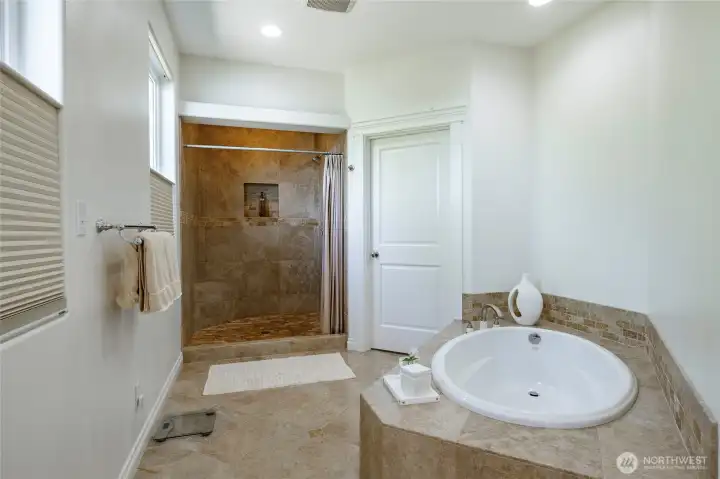 Primary bath with walk-in shower and separate soaking tub Primary bath with walk-in shower and separate soaking tub