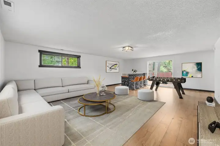 Family Room with slider to fully fenced backyard and deck.