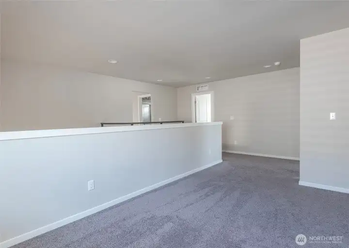 Another view of bonus space off primary bedroom.