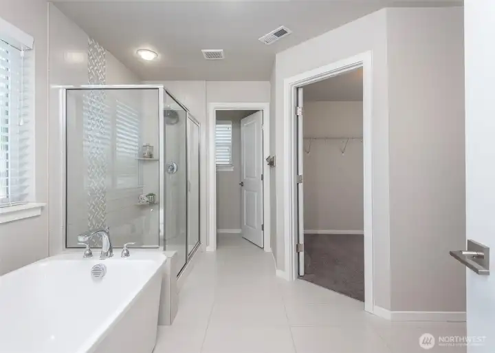 Designed with comfort and convenience in mind, the primary ensuite offers a private water closet and an adjoining walk-in closet, enhancing both privacy and everyday livability.