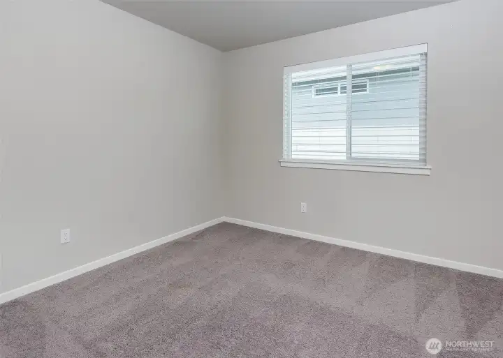 Secondary bedrooms offer the convenience of walk-in closets and an abundance of natural light, enhancing both functionality and livability throughout the upper level.