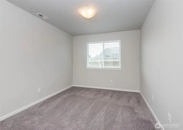 A versatile bonus space is located just off the three upstairs bedrooms, creating an additional area for work, play, or relaxation. This wing of the home is thoughtfully separated from the primary suite, offering added privacy and a well-designed sense of separation within the upper level.