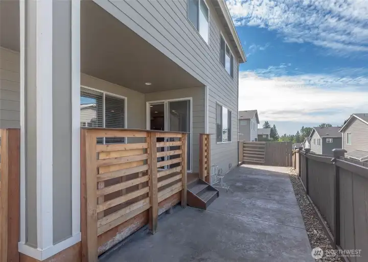 Enjoy virtually maintenance-free outdoor living with beautiful stamped concrete extending around the entire home, providing seamless access, entertaining space, and lasting durability.